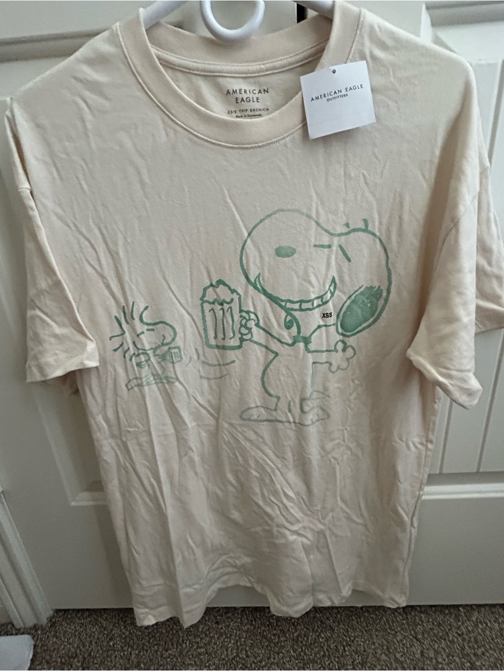 American Eagle Beige Tee with Green Snoopy Graphic